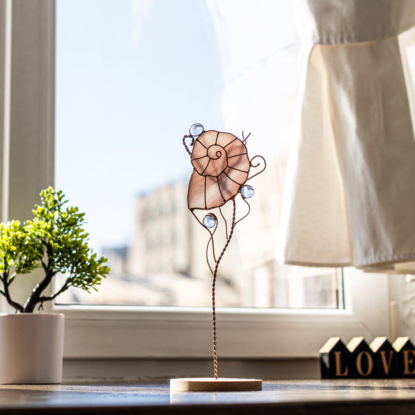 Handcrafted stained glass seashell sculpture on wooden stand, nautical coastal decor with pastel glass and copper wire details
