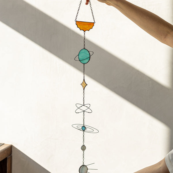 Galaxy-themed stained glass planets suncatcher, handcrafted colorful solar system art, ideal for windows, walls, and space lovers’ decor
