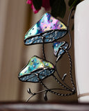 Decorative stained glass mushroom ornament with a blurred background