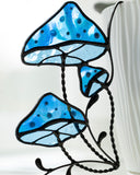 Stained glass blue mushroom design on a white background