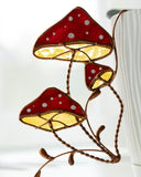 Mushroom-shaped lamp with stained glass design on a white background