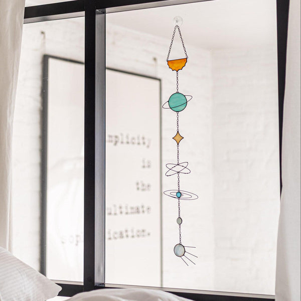 Decorative window sticker with colorful geometric design on a bedroom window
